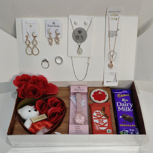 combo gift pack including taddy, 3 Rose sets, watch, 2 sets niklace , 3 sets ring , 2 dairy milk chocolate,  kitkat ,